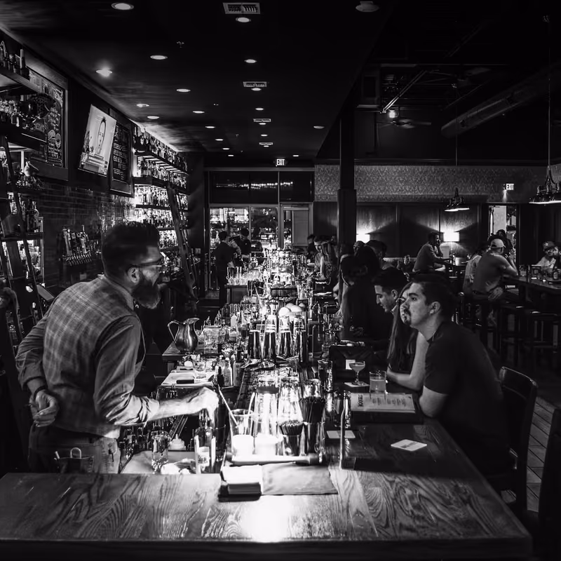 Bartender at work behind the Rock and Rye bar
